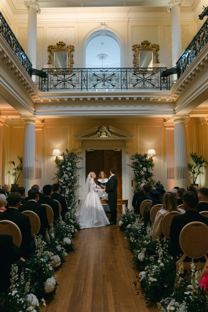 Elegant wedding cake setup with fresh floral décor