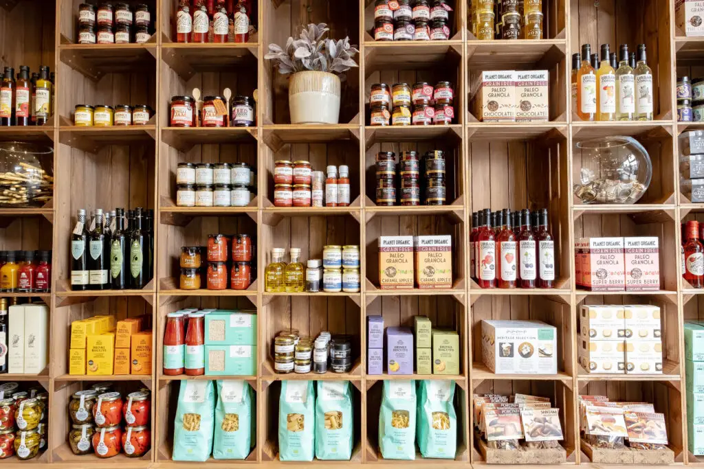 Deli shelves stocked with jars, oils and store cupboard favourites