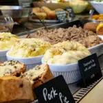 Freshly prepared deli platter with artisanal breads and cheeses